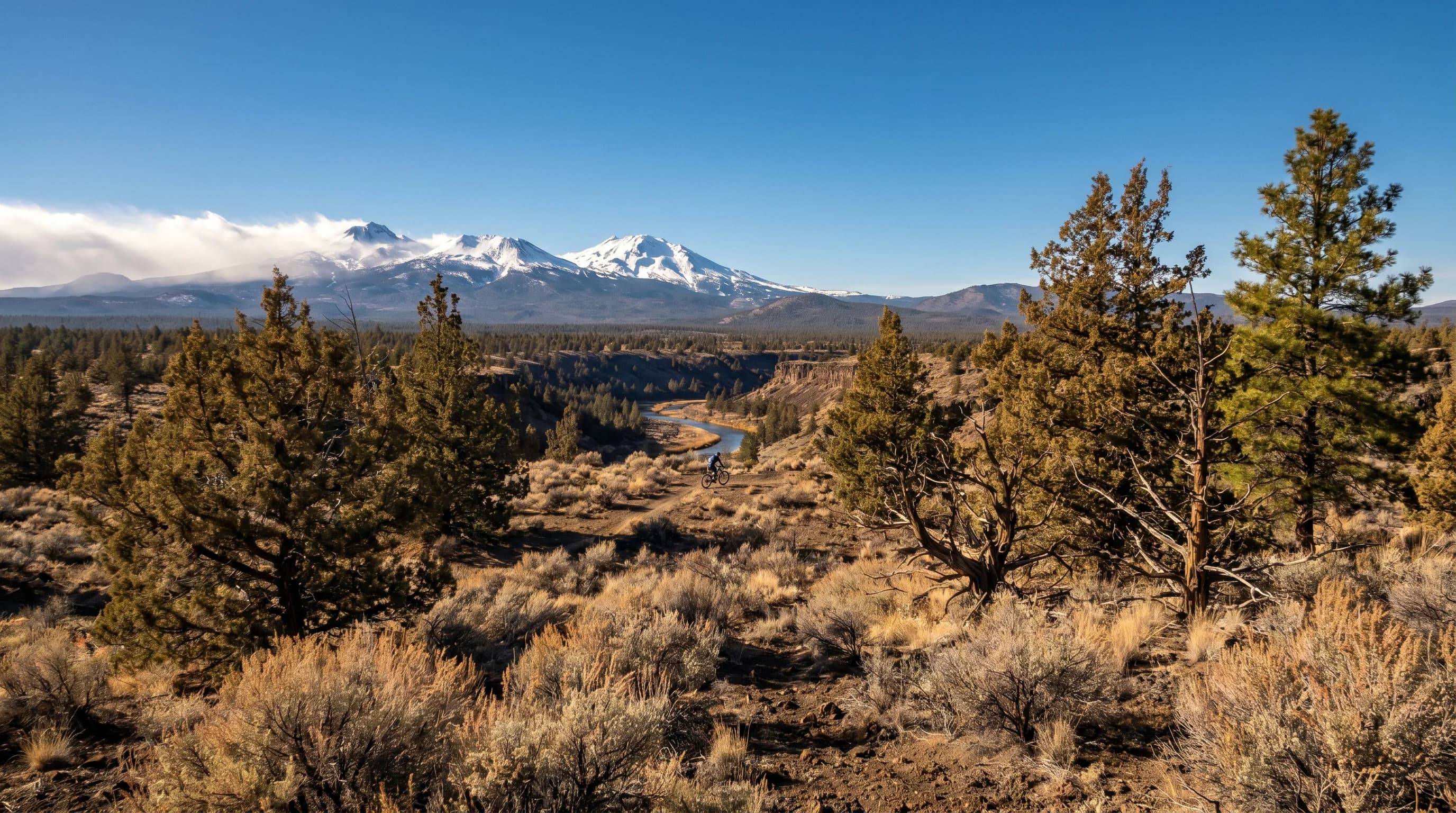 Bright clear sunny day over the Bend high desert with sharp light on the Cascades to the west